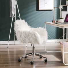 a white chair sitting on top of a hard wood floor next to a wooden table