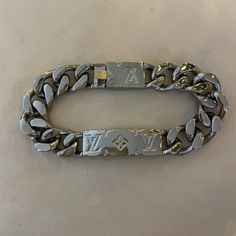 Gifted But Never Worn Lv Chain Bracelet. Mens Or Womens. See Serial Number For Additional Details. Designer Silver Chain Bracelets, Luxury White Gold Bracelets With Silver-tone Logo, Luxury Engraved White Gold Chain Bracelet, Lv Bracelet, Louis Vuitton Chain, Monogrammed Cuff, Mens Chain Bracelet, Lv Men, Louis Vuitton Jewelry