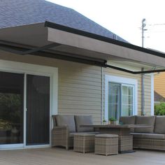 an outdoor patio with furniture and sliding glass doors