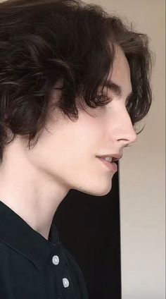 a close up of a person wearing a black shirt