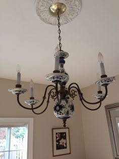 a chandelier hanging from the ceiling in a room