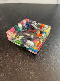 an assortment of colorful toothbrushes in a plastic container