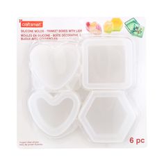 three heart shaped plastic trays with gummy bears on them in the packaging for each