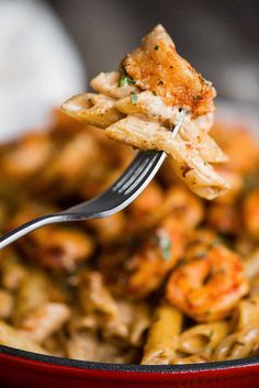 a fork with some food on it in a bowl