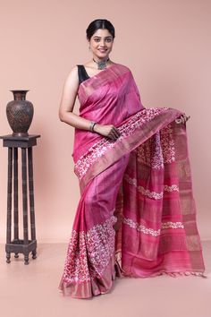 Exclusive arrangement of Hand Block Printing in floral and leaves patterns on pure Zari Border Tussar Saree from Bengal. Perfect for any celebration wear. COLOUR: Pink and White CRAFT: Hand block printing DIMENSIONS: Saree length 6.5 Mts., Saree width 1.14 Mts. Blouse piece inclusive. NET QUANTITY: 1 pc saree PATTERN: Floral and leaves PRODUCT MATERIAL: Handwoven Pure Zari Border Tussar saree PRODUCT TYPE: Saree with Blouse piece WEIGHT: 450 g  WASH INSTRUCTIONS: Dry Clean recommended for this product. Iron inside out. Do not bleach and expose this product to excessive heat and sunlight for long. Saree Trends, Tussar Silk Saree, Blouse Piece, Leaf Pattern, Silk Sarees, Hand Weaving, Saree, Silk, Bathing Beauties