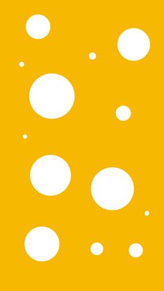 a yellow background with white circles on it