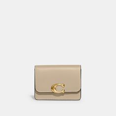 Don’t let its name fool you: the put-together Bandit is as sophisticated as they come. Secured by a snap closure this petite case opens to reveal a hero card slot and an open compartment to stash cash and coins. Crafted of luxe refined leather featuring our C hardware it has three convenient exterior card slots for easy organization. | Coach Bandit Card Case - Women's - Brass/ivory Coach Bandit Card Case, Compact Card Holder With Coin Pocket, Chic Compact Coin Purse With Interior Card Slots, Elegant Compact Trifold Wallet With Coin Pocket, Elegant Trifold Coin Purse With Card Slots, Compact Trifold Wallet With Card Slots, Compact Trifold Wallet With Interior Card Slots, Chic Formal Coin Purse With Card Slots, Classic Compact Coin Purse With Card Slots