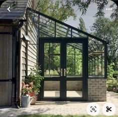 an image of a glass house in the yard