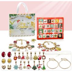 an assortment of christmas themed jewelry and bracelets in a gift bag with matching charms