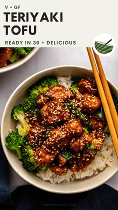 a bowl filled with meat and broccoli next to chopsticks on top of rice