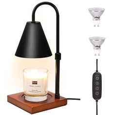 a table lamp with three lights on each side and a remote control next to it