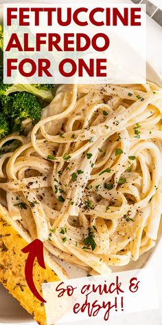 a white plate topped with pasta and broccoli next to a piece of bread