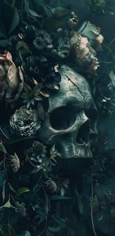 a skull surrounded by flowers and leaves