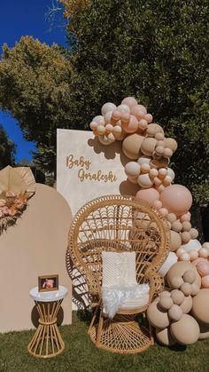 an outdoor display with balloons and chairs