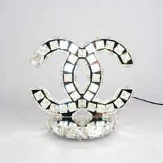 a crystal chandelier lamp with the shape of a double - g on it