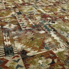 an area rug with many different colors and patterns