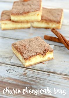 three pieces of cheesecake bars with cinnamon on top