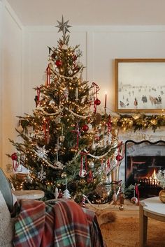 a living room with a christmas tree in the corner