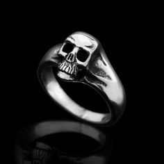 Can be very cool pinky ring. Sterling Silver Small Old Skool Skull Ring. Shiny polished on the surface and oxidized in the gaps. Average Silver Weight: 5 gr. Sizes Available: 47-60 EUR / 4-9 US Other sizes might be available by request:) Unisex. More Skull rings : www.etsy.com/shop/MrSmithJewelry?ref=hdr_shop_menu&search_query=Skull+Ring Back to my shop : www.etsy.com/shop/MrSmithJewelry For more rings : www.etsy.comshop/MrSmithJewelry?ref=hdr_shop_menu§ion_id=18467445 Handmade Made with sty Edgy Halloween Rings For Gift, Edgy Silver Skull Ring As Gift, Edgy Silver Skull Ring For Gift, Punk Skull Rings As Gift, Edgy Skull Ring Gift, Edgy Skull Ring As A Gift, Edgy Skull Ring For Gift, Edgy Skull Ring For Halloween Gift, Edgy Skull Ring For Halloween