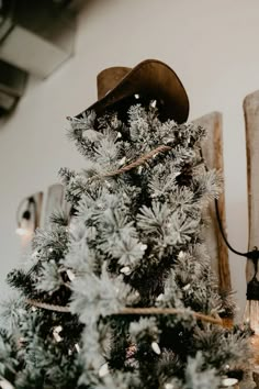 a christmas tree with a cowboy hat on top