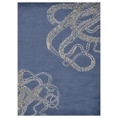 an octopus rug is shown in blue and white colors, with the tentacles drawn on it