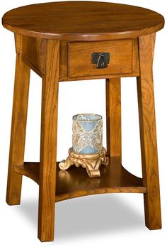 a small wooden table with a vase on it