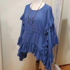 Gorgeous Blouse By Olympiah, The High-End Luxury Designer Mother-Daughter Duo From Sao Paulo, Brazil. Formed Out Of The Love Of Putting Needle To Thread, For Women Who Love Passion And Originality In Their Clothes. Size 40 Is Equal To A 6, But Would Fit A Size 8 Better. Retail Approx $254 New With Tags! Slate Blue Color (Like Actual Photos) Ruffled Sleeves Cascade Down The Sides Of The Blouse. Round Neckline, Ruched Waist, Side Ties. Measures 38" Bust, Length From Shoulder Is About 28" Flowy Blouse With Ruffle Hem And Sleeves, Flowy Ruffle Sleeve Blouse With Ruffle Hem, Flowy Blue Top With Ruffle Sleeves, Blue Flowy Top With Ruffle Sleeves, Blue Flowy Tops With Ruffle Sleeves, Summer Ruffle Sleeve Layering Blouse, Spring Blue Blouse With Butterfly Sleeves, Blue Flutter Sleeve Tops With Ruffle Hem, Flowy Ruffle Sleeve Blouse With Ruffles