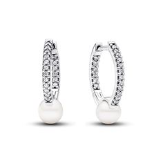 Keep it classy with our Treated Freshwater Cultured Pearl Hoop Earrings. Crafted in sterling silver, the slightly squared hoops showcase a delicate concaved section featuring a treated freshwater cultured pearl. The click closure ensures a secure fit. This pair, an everyday addition to the Pandora Timeless collection, celebrates the timeless allure of pearls and the artful interplay of materials. Please note each treated freshwater cultured pearl is unique and can vary in size and colour; normal wear and tear may occur with this material. Our freshwater cultured pearls are treated with bleaching and lustre enhancement. Pandora Pearl, Bracelet Pandora, Everyday Gifts, Halo Earrings Studs, Pearl Hoop Earrings, Freshwater Cultured Pearls, Pavlova, Sterling Silver Earrings Studs, Pandora Jewelry