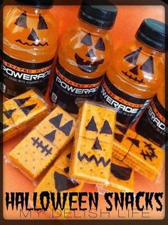 halloween crackers with jack - o'- lanterns on them and candy in the background