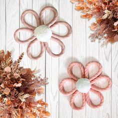 three different types of hair accessories on a white wooden surface