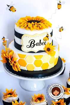 a cake with sunflowers and bees on it