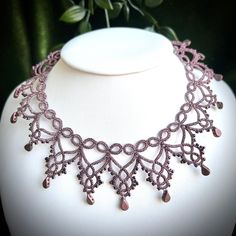 Delicate necklace inspired by snowflakes. It was made by hand using the tatting lace method. Necklace shine in every move because of beads and sparkling metallic thread.  Burgundy shade of color is perfect for little black dress or to emphasize the color of gown.  Necklace is tied with ribbon. Necklace length is 32 centimeters. The tatting lace is an extremely precise and labor-intensive technique. It consists of thousands knots tied manually using a shuttle. For many years I have been specializing in this technique. I choose the highest quality threads and beads so that my jewelry was not only beautiful and properly composed, but also durable and pleasant to wear. I pack my jewelry in a decorative box. Bridgerton Diy, Weaving Necklace, Elven Necklace, Fairycore Jewelry, Jewellery Patterns, Tatting Necklace, Beaded Flowers Patterns, Wire Wrapping Jewelry, Wrapping Jewelry