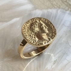 My icon This is a beautiful Emperor Alexander Severus brass coin ring. Alexander Severus was born in 208, in Phoenicia, and died in 235, in Gaul. Severus was emperor of Rome from A.D. 222-235. The coin is oxidized but the band is smooth and brilliant. (code-RK1493) © 2011 Artisanimpact Inc. All rights reserved. Construction & Dimensions: Brass. (PLEASE NOTE that brass may turn the skin green) Approximate diameter 16mm (0.63in). We can make any size, including quarter sizes. Please choose you Ancient Hawaii, Gold Coin Ring, My Icon, Golden Coin, Rose Quartz Earrings, Simple Ring, Solid Gold Earrings, Coin Ring, Ring Simple