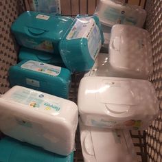 there are many different types of baby diapers in the carton and one is blue