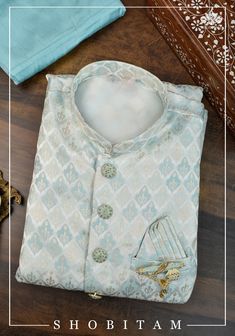 Item: Meenakari Floral Embroidered Kurta and Blue Pajama Fancy buttons and brooch. No Lining. Celebrate Life's special occasions with style! Blending the best of tradition, trend, style, ease, and comfort, our men's line comes in elegant hues that can brighten any occasion. You can pair this Kurta with the Pajama that it comes with or sport a casual Indo-Western look by pairing it over jeans! The pajama has an adjustable drawstring! This Kurta in available in multiple sizes, please refer to the Kurta Pyjama, Fancy Buttons, Western Look, Indo Western, Pyjama Set, Body Size, Salwar Kameez, Celebration Of Life, Pajama Set