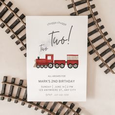 a birthday card with a red train on it and the words to too written in cursive writing