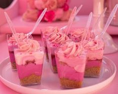 small desserts with pink frosting on a plate