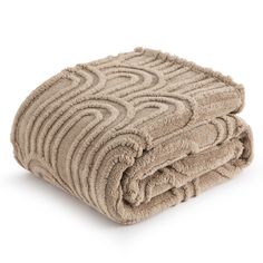 two towels folded on top of each other in the shape of wavy lines and curves