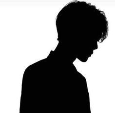 the silhouette of a man holding a cell phone