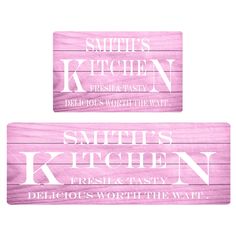 two pink wooden signs with white lettering on them