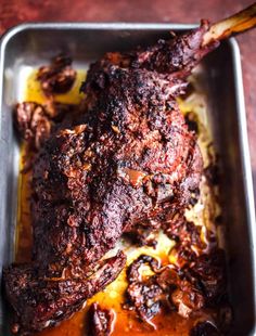 a close up of a meat in a pan on a table