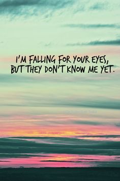 a sunset with the words i'm falling for your eyes, but they don't know me yet