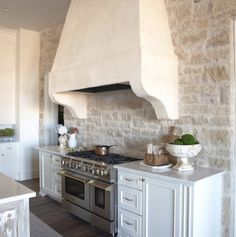 a kitchen with an oven, stove and counter tops in it's center island