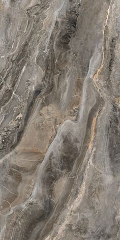 an aerial view of a marbled surface that looks like it has been painted gray and gold