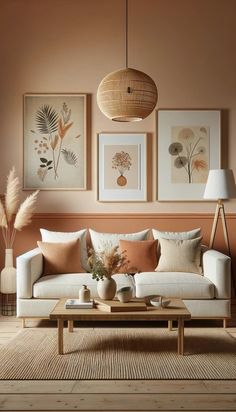 a living room filled with furniture and pictures hanging on the wall above it's coffee table