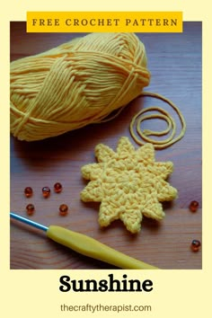 a crochet snowflake next to a ball of yarn and a knitting needle