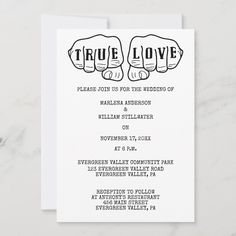 a wedding card with two fists on the front and back of it, in black ink