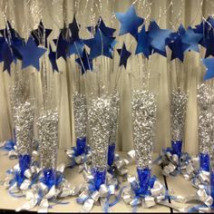 blue and silver stars are on display in front of the curtained room with sequins