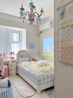 a child's bedroom with a chandelier hanging from the ceiling