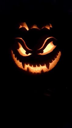 a carved jack o lantern in the dark